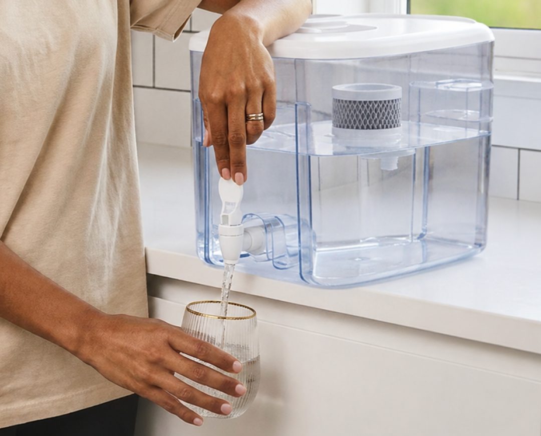 Pouring a glass of filtered water from the Opti Chill